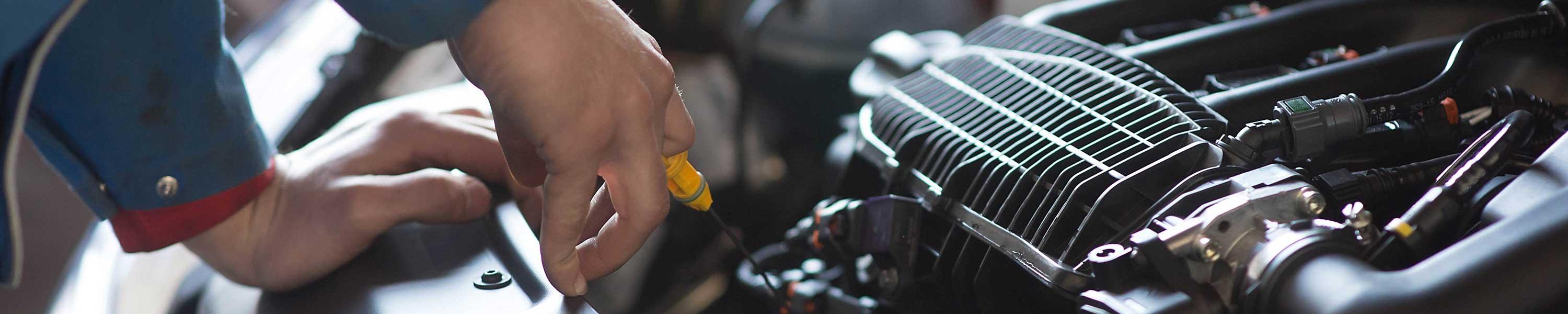 CAA Mechanic working on car