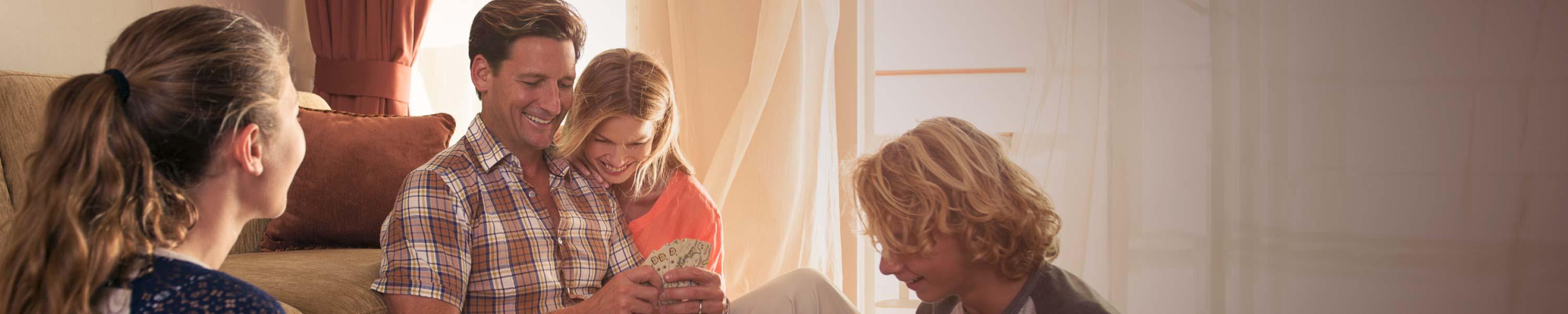 Family playing cards on a cruise ship