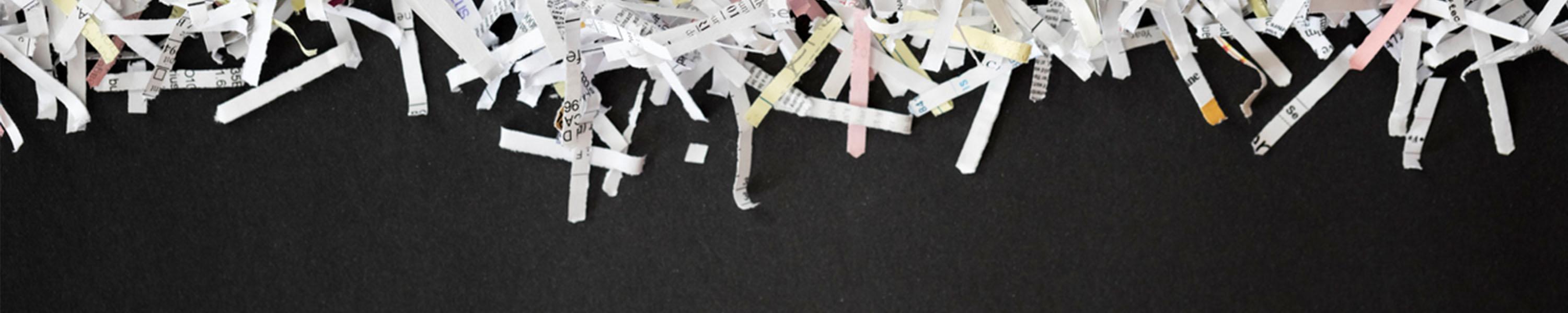 Shredded paper on black background
